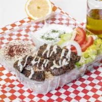 Kafta Kabab Combo · Ground beef with chopped onion, parsley and  season cooked on the top griddle,on a bed of ba...