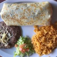 Burrito Solo · Jumbo flour tortilla filled with lettuce, tomato, beans, cheese and sour cream.