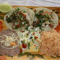 Fish Tacos Plate (2 Tacos) · 2 tacos. Marinated and grilled tilapia in a corn or flour tortilla, topped with pico de gall...