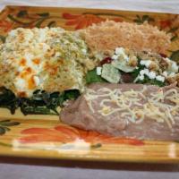 Spinach Enchiladas · 3 corn tortillas filled with sauteed spinach, Muenster cheese, goat cheese and topped with m...