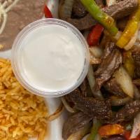 Steak Fajitas Plate Tres Colores · Marinated strips of outer skirt steak grilled with tricolor peppers-red, yellow and green wi...
