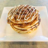 Cinnamon Roll Pancakes · Pancakes topped with cream cheese icing.