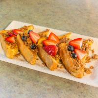 Granola Crunch French Toast · Granola dipped French toast with fresh fruit.