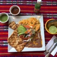 Pollo a la Parrilla · Grilled chicken marinated in special house sauce served with rice and beans tortillas.