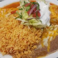 Burrito Poblano · Your choice of chicken, shredded beef or ground beef, topped with lettuce, sour cream, red s...
