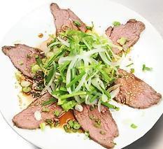 Roast Beef Salad · Sliced roast beef and chive salad with house ponzu sauce. Scallion and sesame seeds on top.