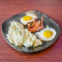 Sausage & Grits · Chicken andouille, fresh tomatoes, sunny side up, egg creamy cheddar grits.