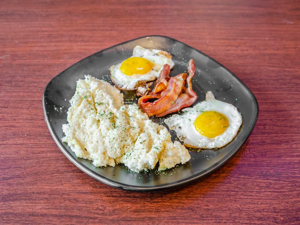 Sausage & Grits · Chicken andouille, fresh tomatoes, sunny side up, egg creamy cheddar grits.