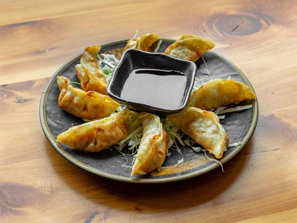 Fried Gyoza · 8 pieces. Japanese dumplings filled with chicken and vegetables, served either fried.