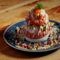 Sushi Tower · Dedicated pieces of salmon, tuna, white tuna are layered with imitation crab meat, avocado a...