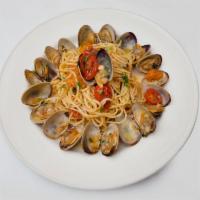 Linguine Alla Vongole · Clams, touch of tomatoes, pinot grigio and hot red pepper flakes.