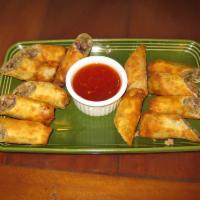 Lumpia · 6 wonton wrappers stuffed with beef, pork, cabbage, green onions, and carrot deep fried and ...