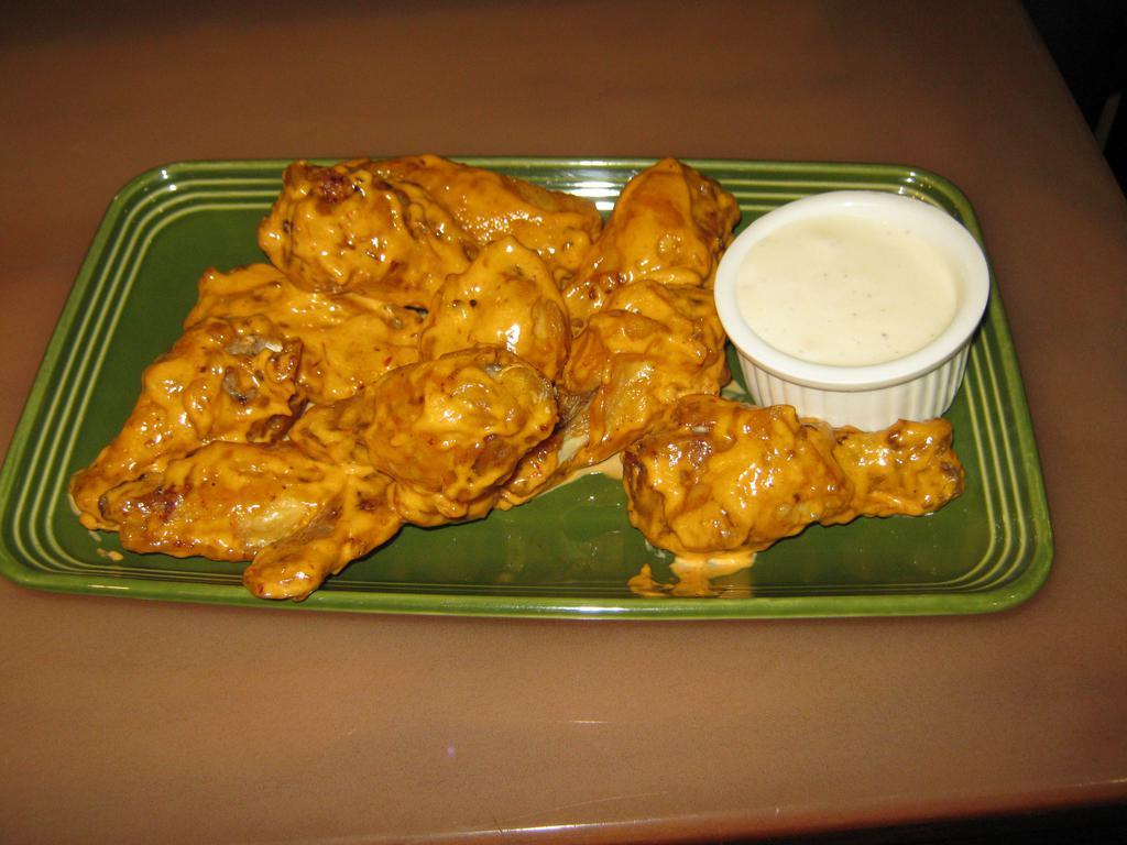 Hot Wings · 1 lb. of tender wings deep fried then coated with choice of franks, BBQ, ghost pepper sauce, chipotle mayo, jerk honey seasoning, sweet chili, Parmesan garlic, mango habanero or stinging honey sauce.