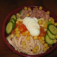 Chef's Salad · Romaine mix with smoked turkey, ham, Swiss and cheddar cheese, boiled egg, cucumbers, tomato...