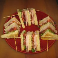 Classic Club · Smoked ham, turkey, bacon, lettuce, tomatoes on triple Decker toasted sour dough bread.