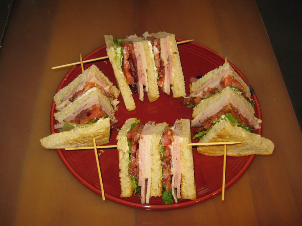 Classic Club · Smoked ham, turkey, bacon, lettuce, tomatoes on triple Decker toasted sour dough bread.