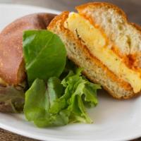 Egg and Cheese Sandwich · Scrambled organic egg, white cheddar, tomato jam on a brioche bun.