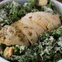 Kale Caesar Salad · With rotisserie chicken, Parmesan, croutons, and house-made Caesar dressing.