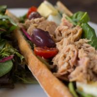 Mediterranean Tuna Sandwich · Organic egg, mesclun greens, tomatoes, black olives, and harissa spread on a French baguette.