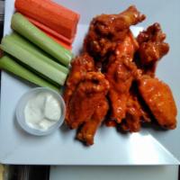 6 Buffalo Wings · Fresh jumbo wings served with veggies and your choice of blue cheese or ranch dressing. Your...