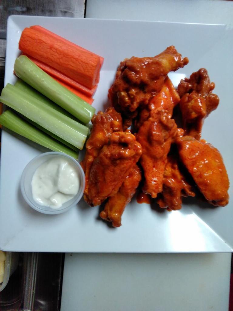 6 Buffalo Wings · Fresh jumbo wings served with veggies and your choice of blue cheese or ranch dressing. Your choice of BBQ, medium or hot sauce.