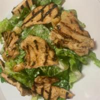 Classic Caesar Salad with Grilled Chicken · Caesar salad topped with croutons and our homemade dressing.