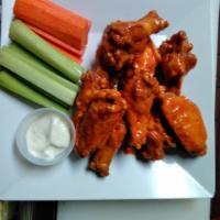 10 Buffalo Wings · Fresh jumbo wings served with veggies and your choice of blue cheese or ranch dressing. Your...