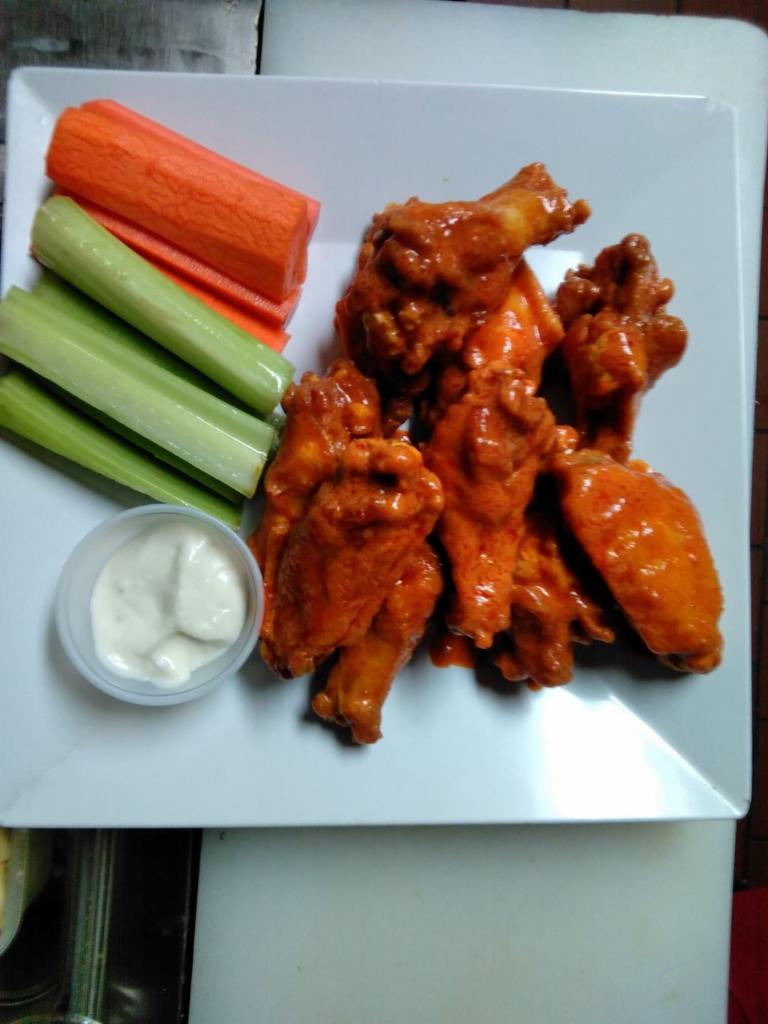 10 Buffalo Wings · Fresh jumbo wings served with veggies and your choice of blue cheese or ranch dressing. Your choice of BBQ, medium or hot sauce.