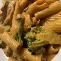 Rigatoni Taste of Italy · Rigatoni tossed with grilled chicken, broccoli florets, tomatoes, a touch of cream and a spl...