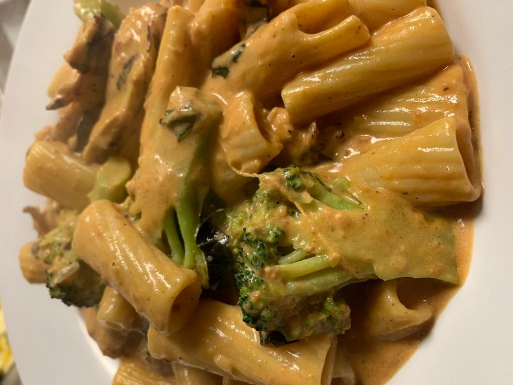 Rigatoni Taste of Italy · Rigatoni tossed with grilled chicken, broccoli florets, tomatoes, a touch of cream and a splash of vodka.