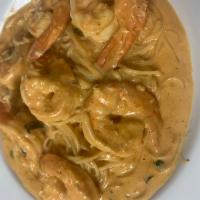Taste Of Italy Shrimp .Dinner  · Jumbo shrimp served on angel hair pasta in pick champagne sauce.