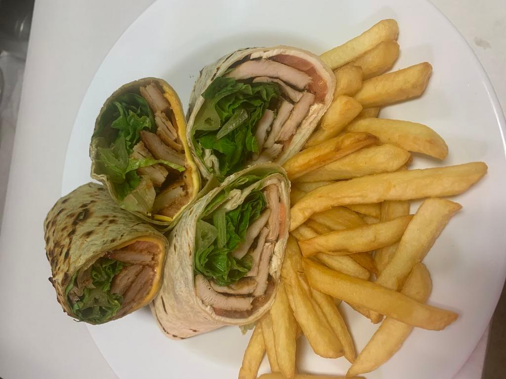 Buffalo Chicken Wrap · Breaded chicken tenders and spicy buffalo sauce on your choice of wrap. with fries