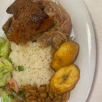 Pernil · Roasted Pork, served with rice, beans, salad and sweet plantains.