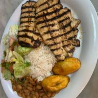 Pechuga de Pollo a la Parilla · Grilled Chicken Breast, served with rice, beans, salad and sweet plantains.