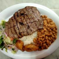 Carne de Res Asada · Grilled Steak with rice, beans, salad, and sweet plantains.