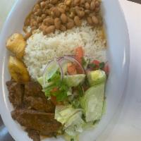 Carne de Res Guisada · Carne de res guisada ,served with rice , beans ,salad and sweet plantains.
