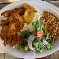 Camarones Apanados · Fried Bread Shrimp ,Served with ,rice ,beans ,salad ,and sweet plantains .