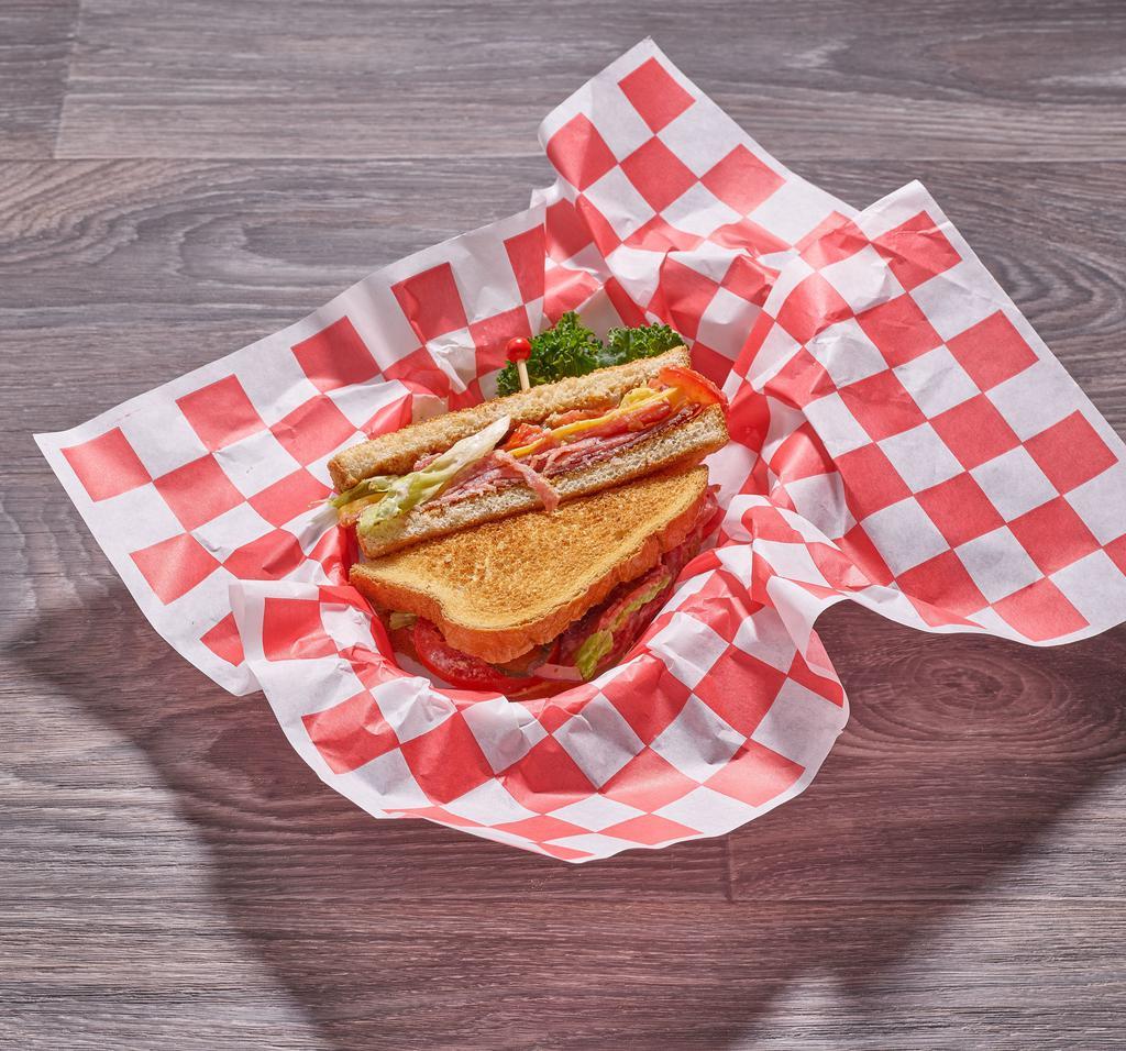 Pastrami Sandwich · Includes mayo, mustard, lettuce, tomato, pickle and onion.