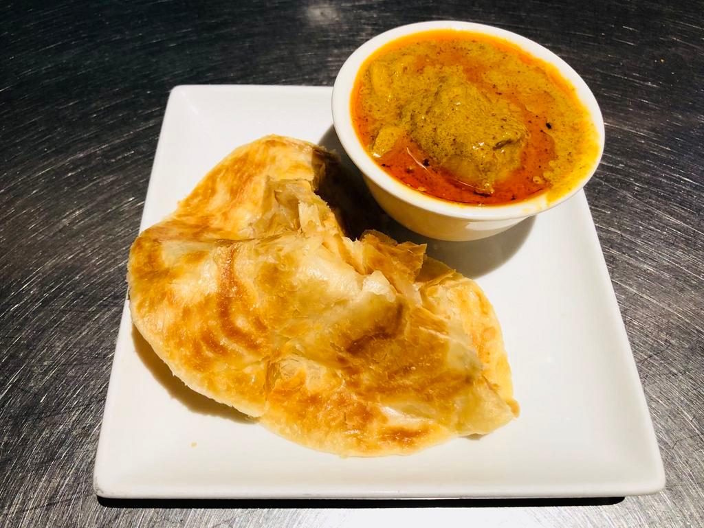 A1. Roti Canai · A Malaysian classic.  Thick and buttery indian pancake served with chicken curry sauce.