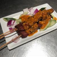 A3. Satay Beef · Marinated beef served with peanut sauce.