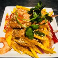 A9. Pasang Mango Shrimp · A red-green pepper salad served with fresh mango and grilled shrimp spread over sweet sour s...