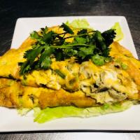 A15. Baby Oyster Omelet · Fried oyster with egg and garlic chives.