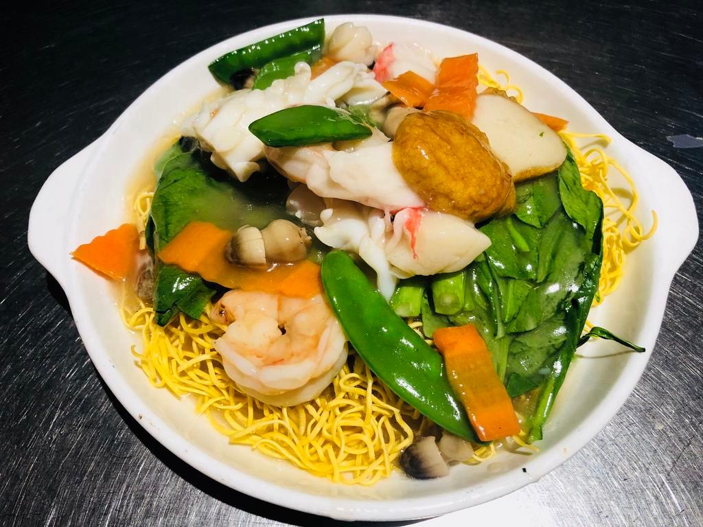 U12. Crispy Seafood Noodle · crispy noodles W. shrimp, squid, fishcakes, crab meat, scallop & carrot, snow peas, mushroom and vegetables