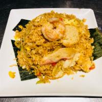F6. Bangkok Seafood Fried Rice · Fried rice in tom yum sauce with prawn, scallop, fish cakes , squid and crab meat.