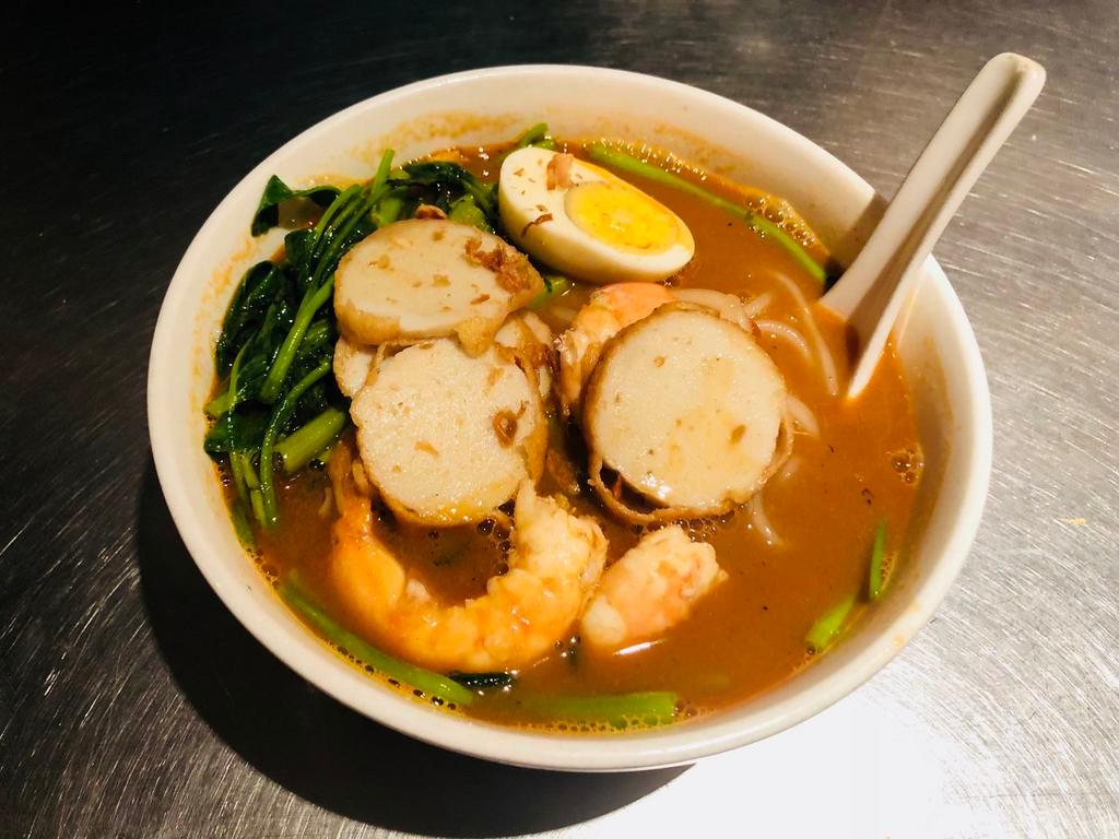 W2. Penang Prawns Noodle Soup · popular street food in malaysia combinations of hard boiled egg ,egg noodles ,shrimp, water spinach and bean sprout in a spicy shrimp broth.