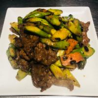 B15. Beef with Asparagus in Black Bean Sauce · Sauteed beef with carrot and asparagus in black bean sauce.