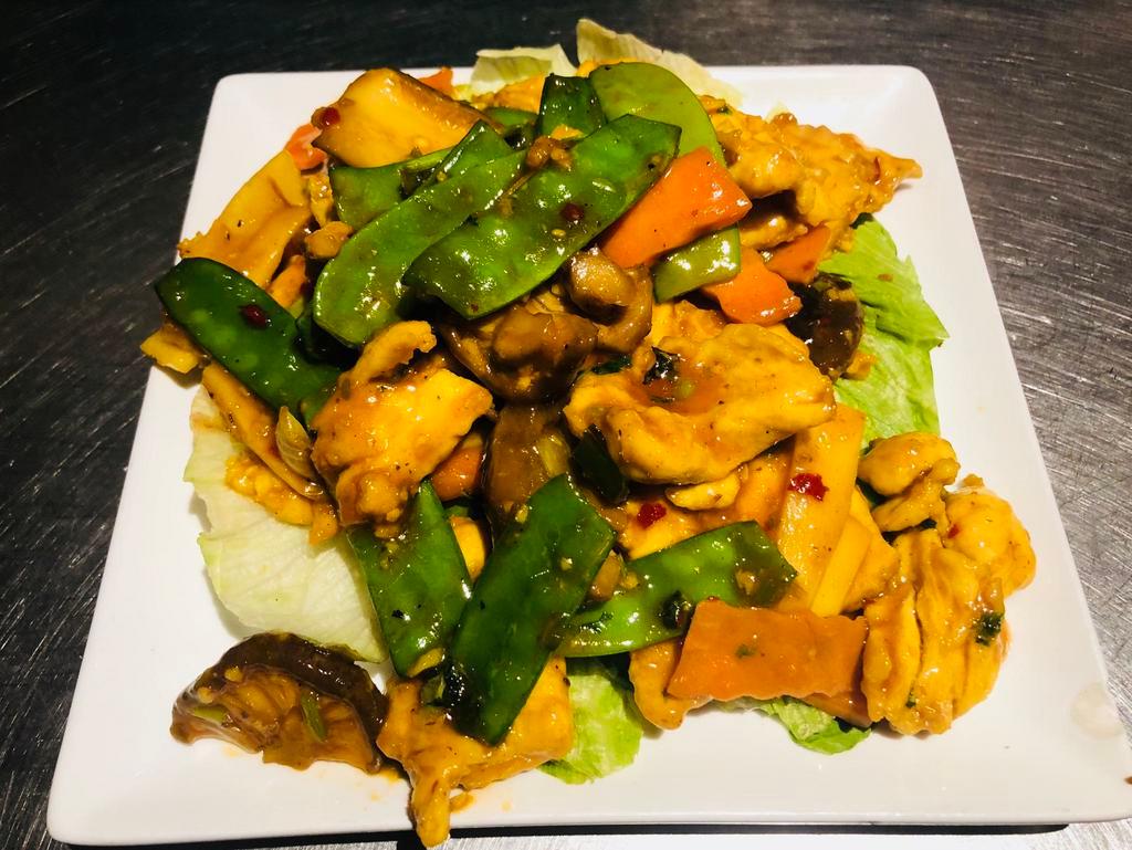 C6. Tangy Spicy Chicken in Thai Style · Sauteed chicken with straw mushroom, snow peas, carrot, bamboo shoot and basil leaf in spicy sauce.