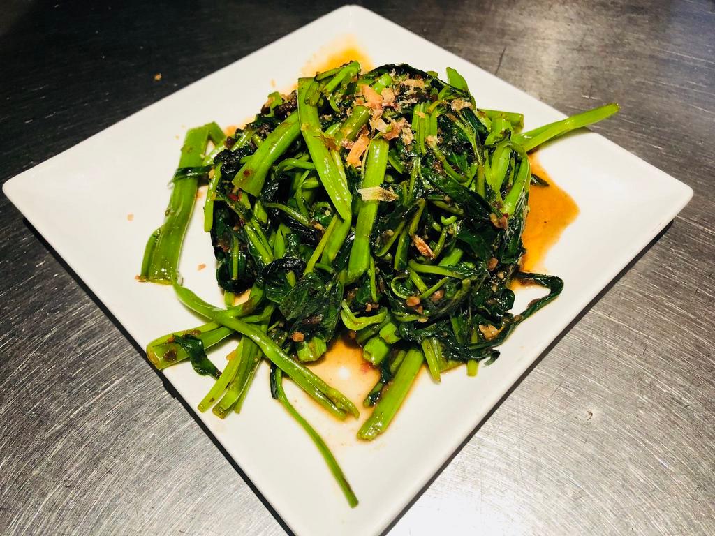 V2. Kang-Kong fried with sambal Belacan · Malaysia's famous vegetable  ( water spinach) fried with chilli and shrimp paste.