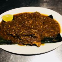 Asam Sting Ray Fish on Banana Leaf · With homemade Malaysia spicy sauce.