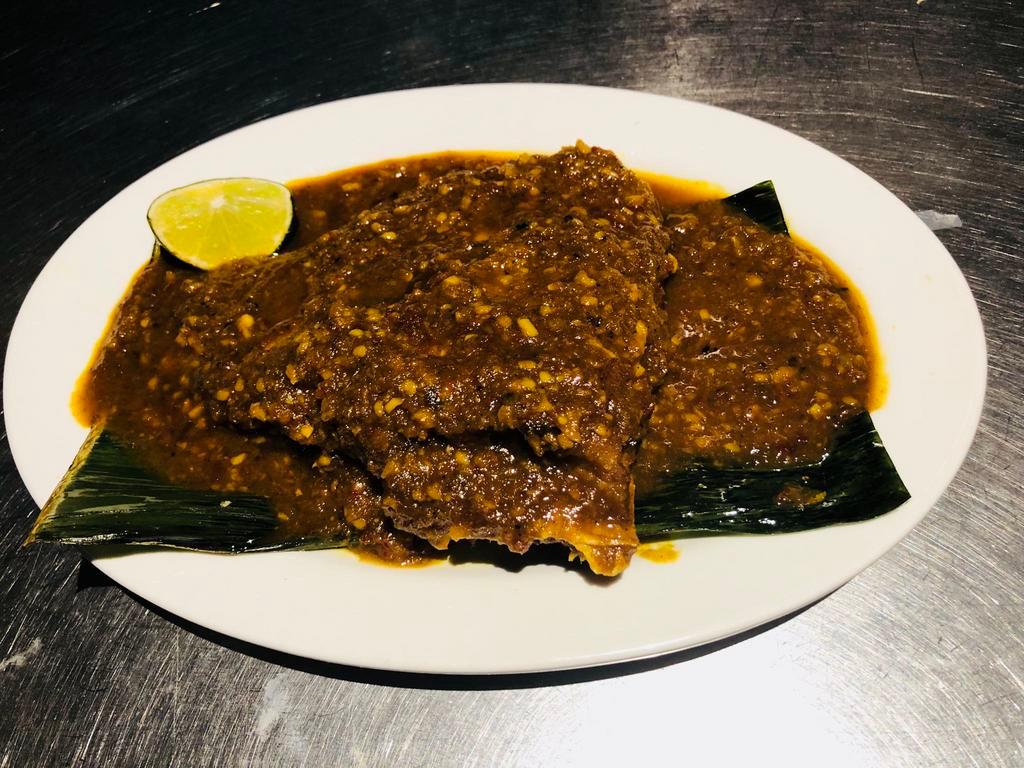 Asam Sting Ray Fish on Banana Leaf · With homemade Malaysia spicy sauce.